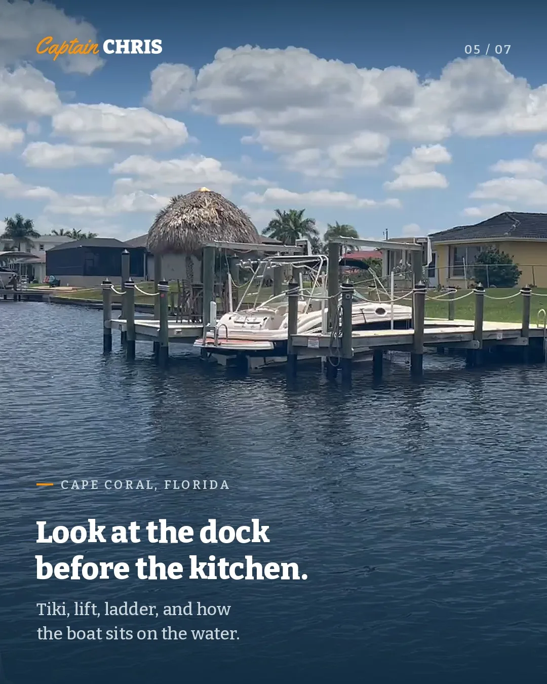 Carousel slide: a tiki dock with a boat on a lift, headline Look at the dock before the kitchen